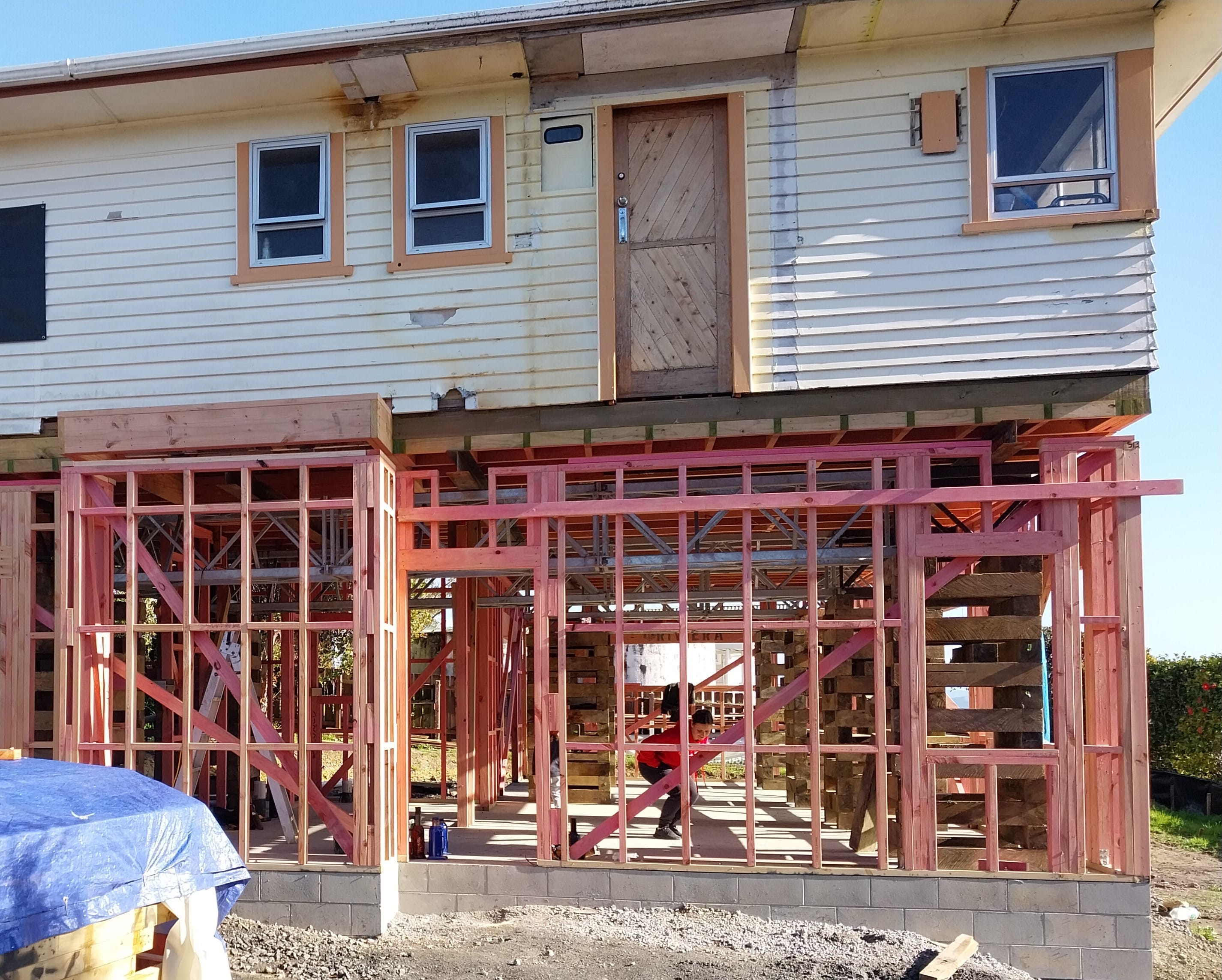 House lifting with ground floor extension framing installed beneath the elevated structure